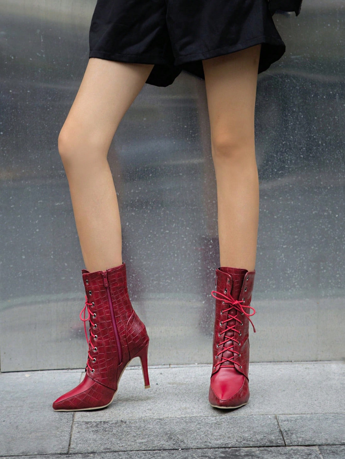 Stay stylish and warm this winter with Crocodile Chic Boots. Designed for the office commute, these boots feature a belt buckle and lace-up design for added flare. With a crocodile pattern, these boots will elevate any outfit. Made for comfort and durability, they are a must-have for any fashion-forward woman.