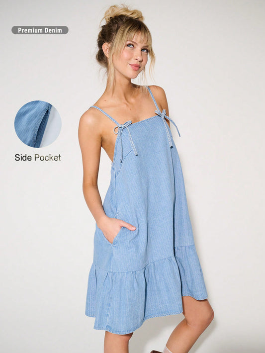 Upgrade your summer wardrobe with our Chic Bow Denim Mini Dress. Made from premium denim fabric, this dress is both chic and comfortable. The stylish bow detail adds a touch of sophistication to your outfit, making it a must-have for any summer occasion. Stay fashionable and cool with this summer style essential.