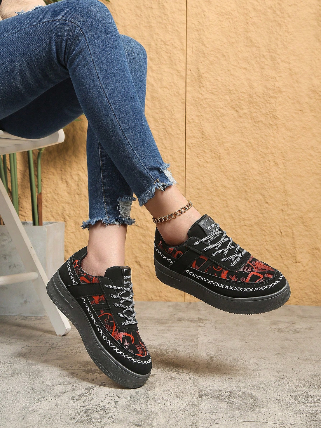 Elevate your style and height with our Chic Black Printed Sneakers. Featuring a waterproof platform, these casual shoes not only add a touch of chicness to your outfit, but also keep your feet dry in wet conditions. Perfect for any occasion, these sneakers are a must-have for any fashion-savvy individual.