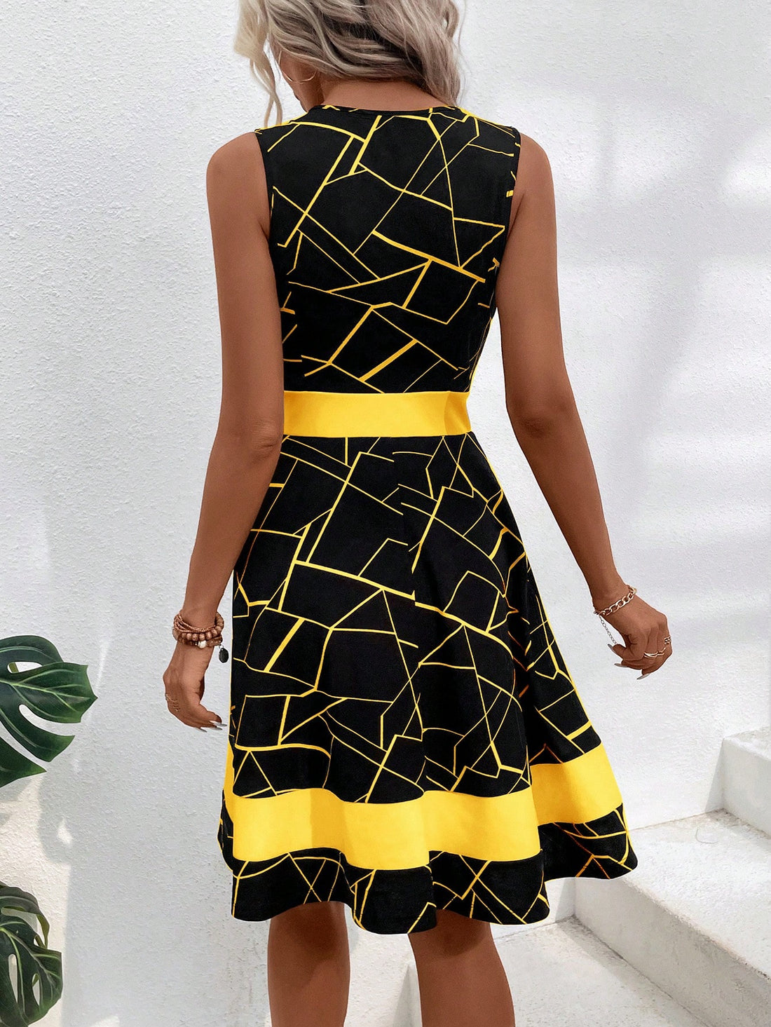 Effortlessly elevate your style with our Chic Geo Print A-Line Dress in Classic Black. The versatile A-line silhouette and modern geo print make for a timeless combination that will turn heads. Embrace effortless elegance with this must-have dress.