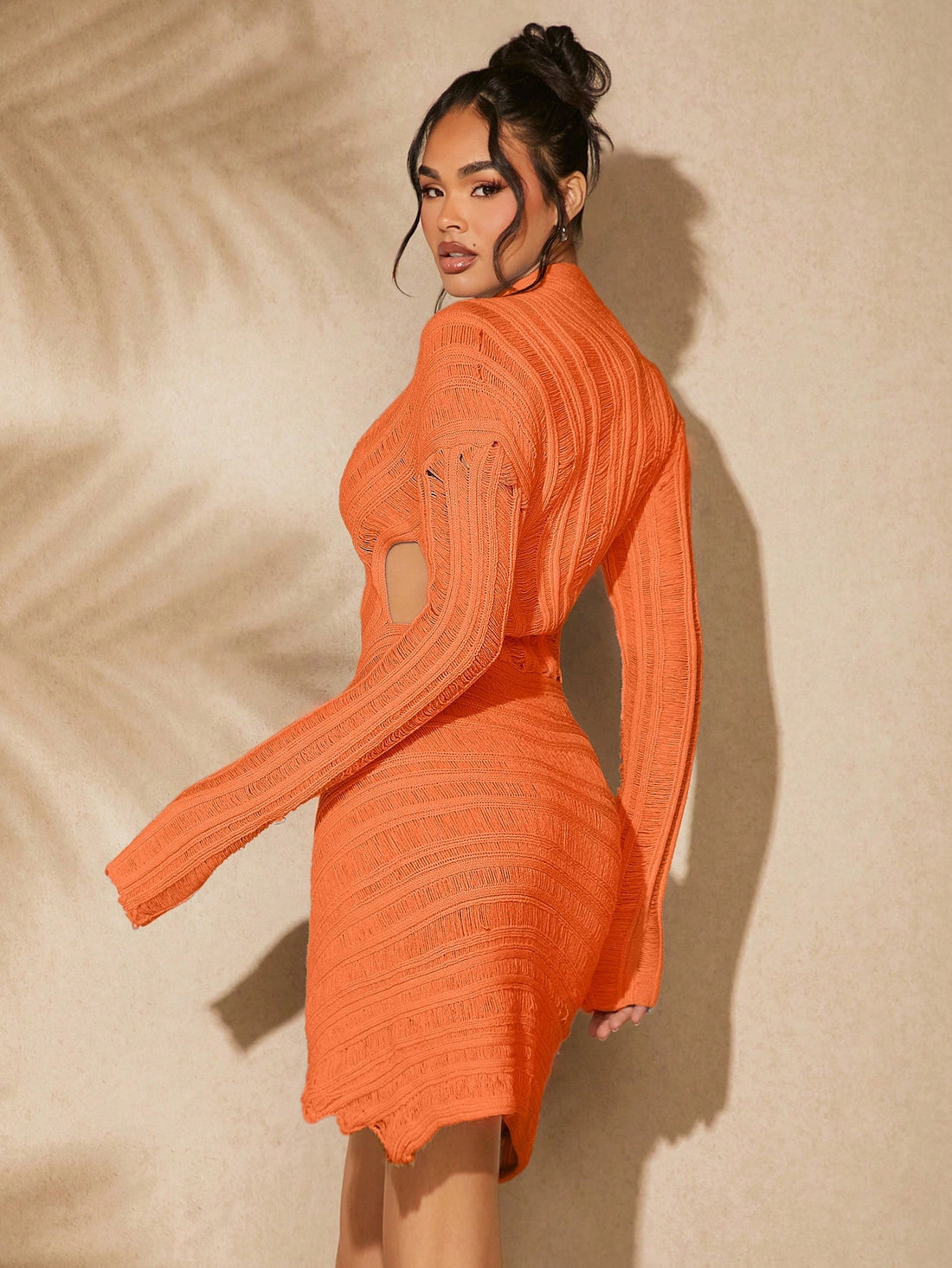 Get ready to turn heads with our Chic Asymmetrical Hem Sweater Dress! This fall must-have features a trendy hollow-out design and flattering asymmetrical hem. Stay cozy while looking stylish - perfect for any occasion. (Fashionable, versatile, and oh-so-comfortable!)