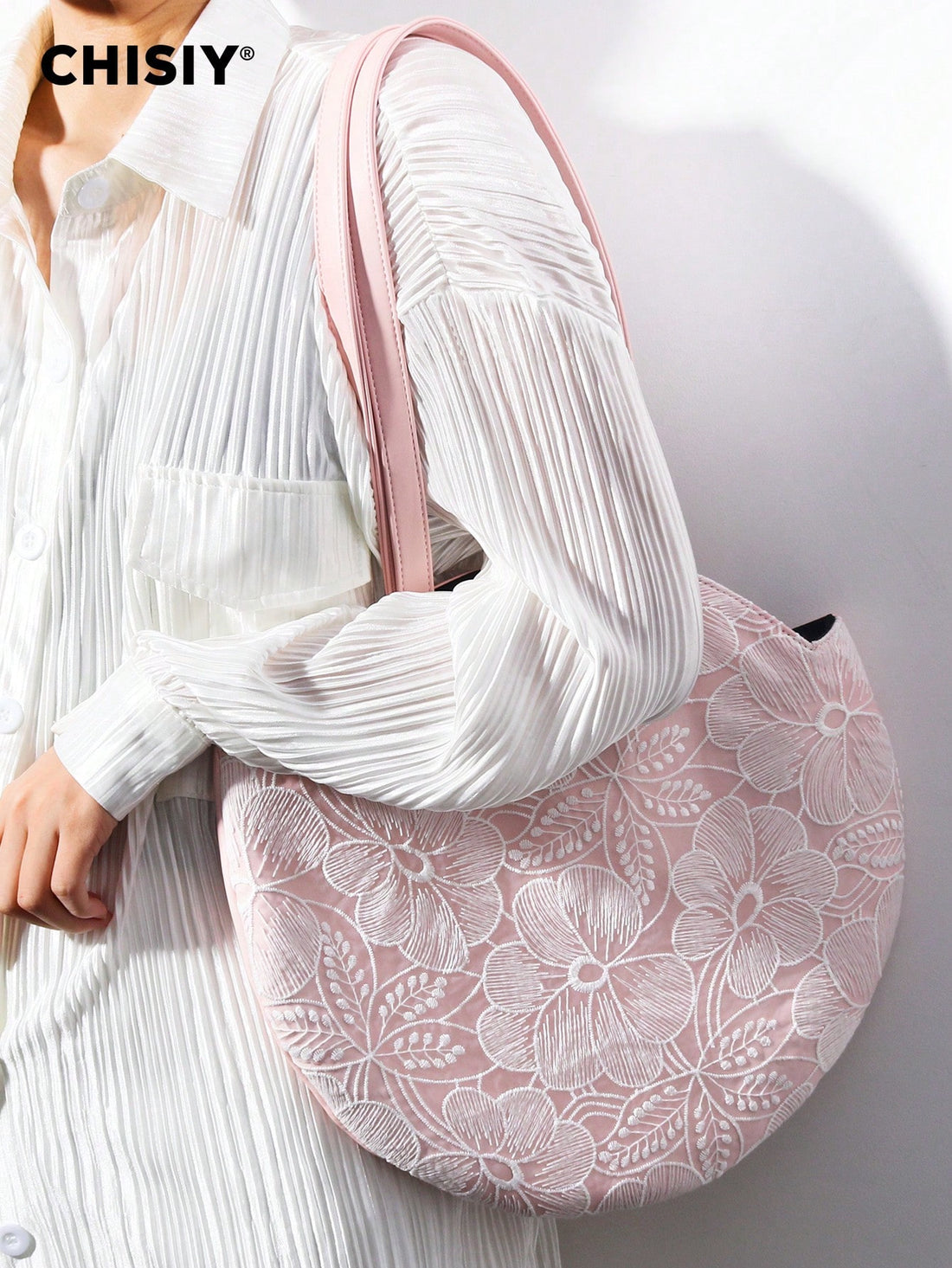This Pink Provence Lace Circular Bag is perfect for the stylish and professional woman on-the-go. With its elegant lace design and circular shape, it's both fashionable and functional. Use it as a versatile business commuter bag for all your daily essentials.