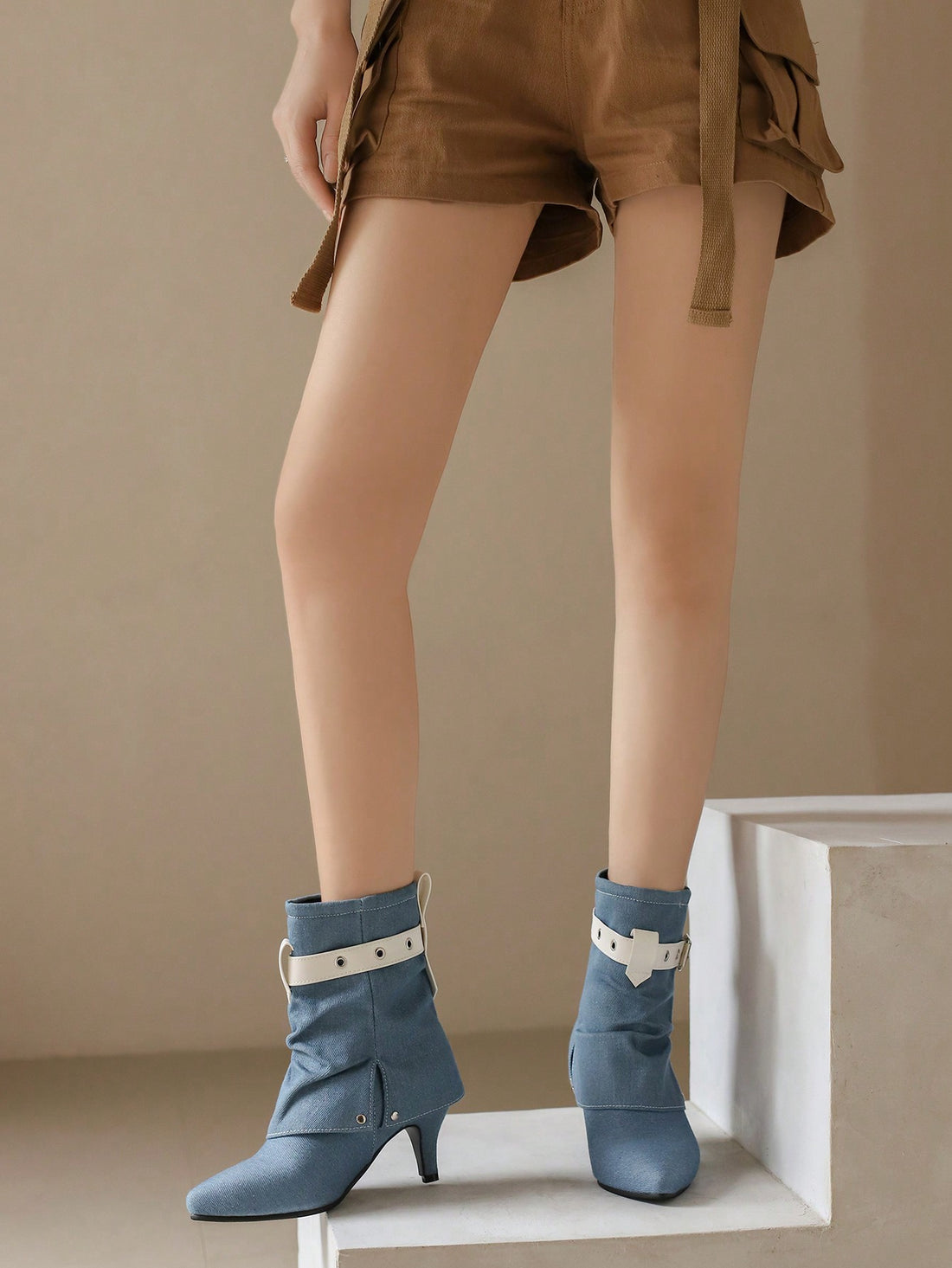 Elevate your fall/winter style with our Color Block Belt Buckle High Heel Boots. These versatile must-haves offer a perfect balance of fashion and function, featuring a color block design and chic buckle accents. Step up your shoe game with confidence and comfort in every step.