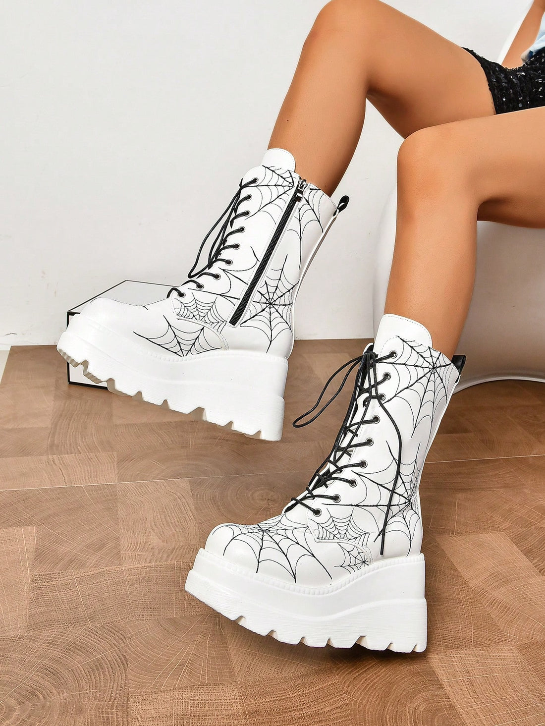 Upgrade your shoe collection with these stylish white lace-up mid-calf boots. With thick soles, these boots make the ultimate statement piece. Perfect for any occasion, their sleek and modern design will elevate your look and provide optimal comfort. 