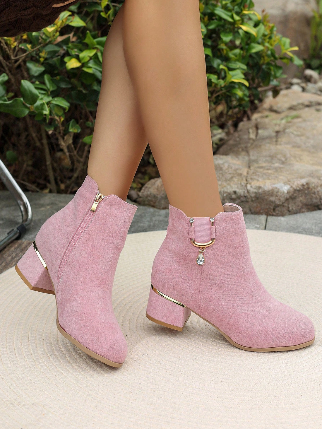 Step into the season with these stunning suede ankle boots that blend comfort with glamorous style. Featuring a eye-catching rhinestone buckle detail, they're the perfect statement piece for elevating your autumn and winter wardrobe. The soft suede construction keeps your feet cozy while the sleek silhouette works with everything from jeans to dresses. Whether you're heading to brunch or a night out, these boots deliver that effortless chic vibe that turns heads. Your feet will thank you for the cushioned c