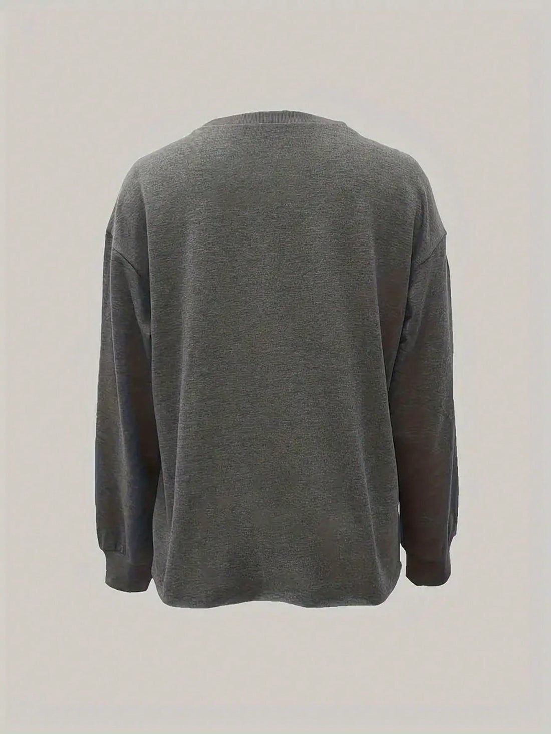 Experience chic comfort with our Letter Graphic Drop Shoulder Sweatshirt. Made with soft, high-quality material, this sweatshirt will keep you cozy while making a stylish statement. Its unique design and drop shoulder feature add a fashionable touch to your wardrobe. Stay comfortable and trendy with our Chic Comfort sweatshirt.