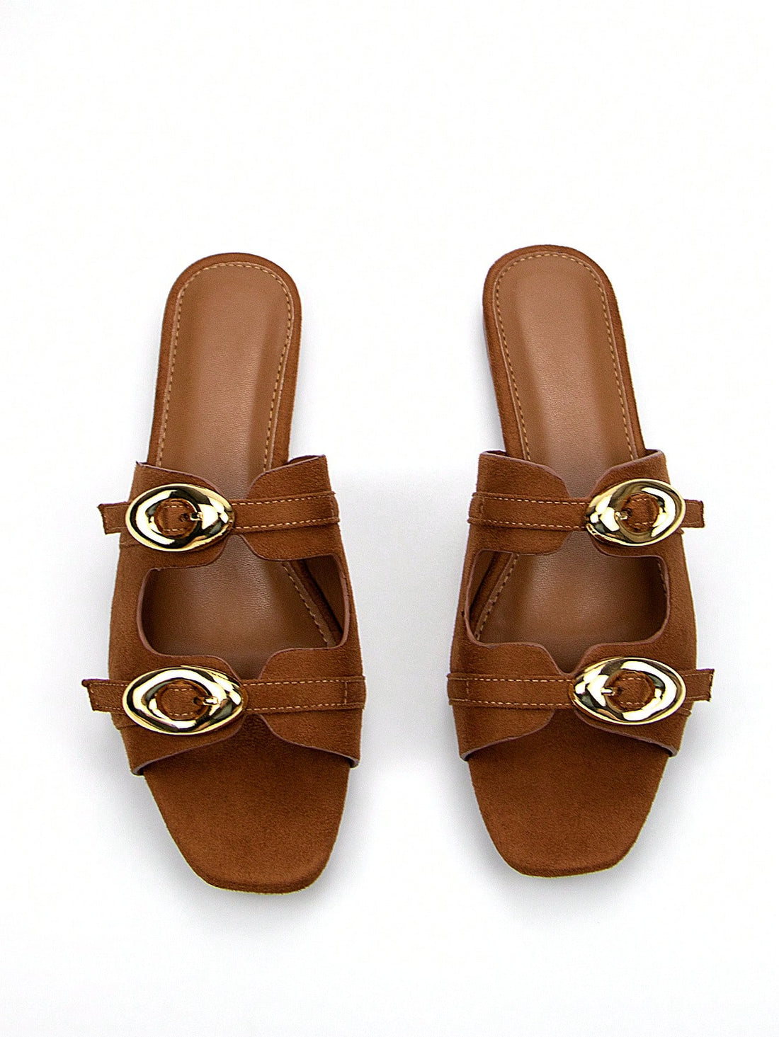 Slip into style with our Chic Brown Suede Square Toe Flat Mules. Featuring an adjustable strap and gold buckle, these versatile shoes are perfect for everyday wear. Make a statement with your feet and step into comfort and fashion.