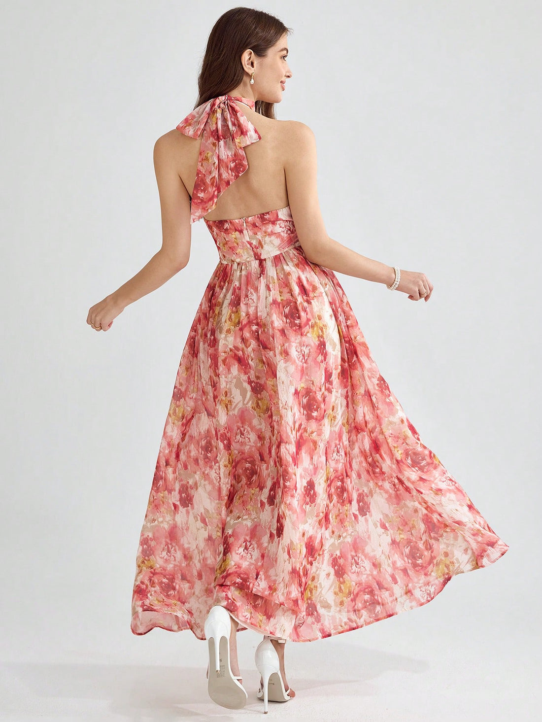 This floral sundress is perfect for any occasion! With its backless design, halter neckline, and charming print, you'll turn heads wherever you go. From weddings to parties to summer vacations, this dress has got you covered. Look beautiful and feel confident in this must-have piece!