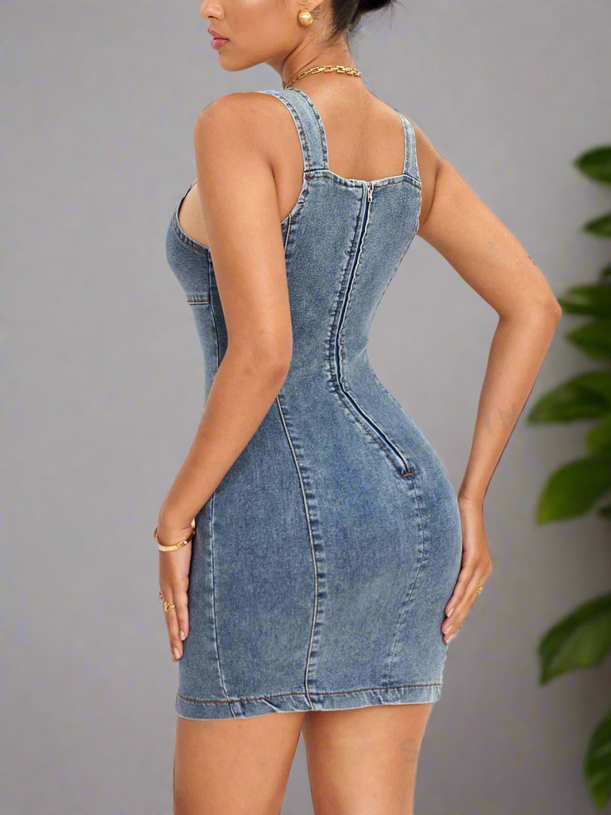 This Essence Zip Back Bodycon Denim Dress is a must-have for any fashionista's wardrobe. Its bodycon fit flatters your figure while the zip back detail adds a touch of edge. Made from high-quality denim, this dress is both stylish and durable, making it a long-lasting wardrobe staple.