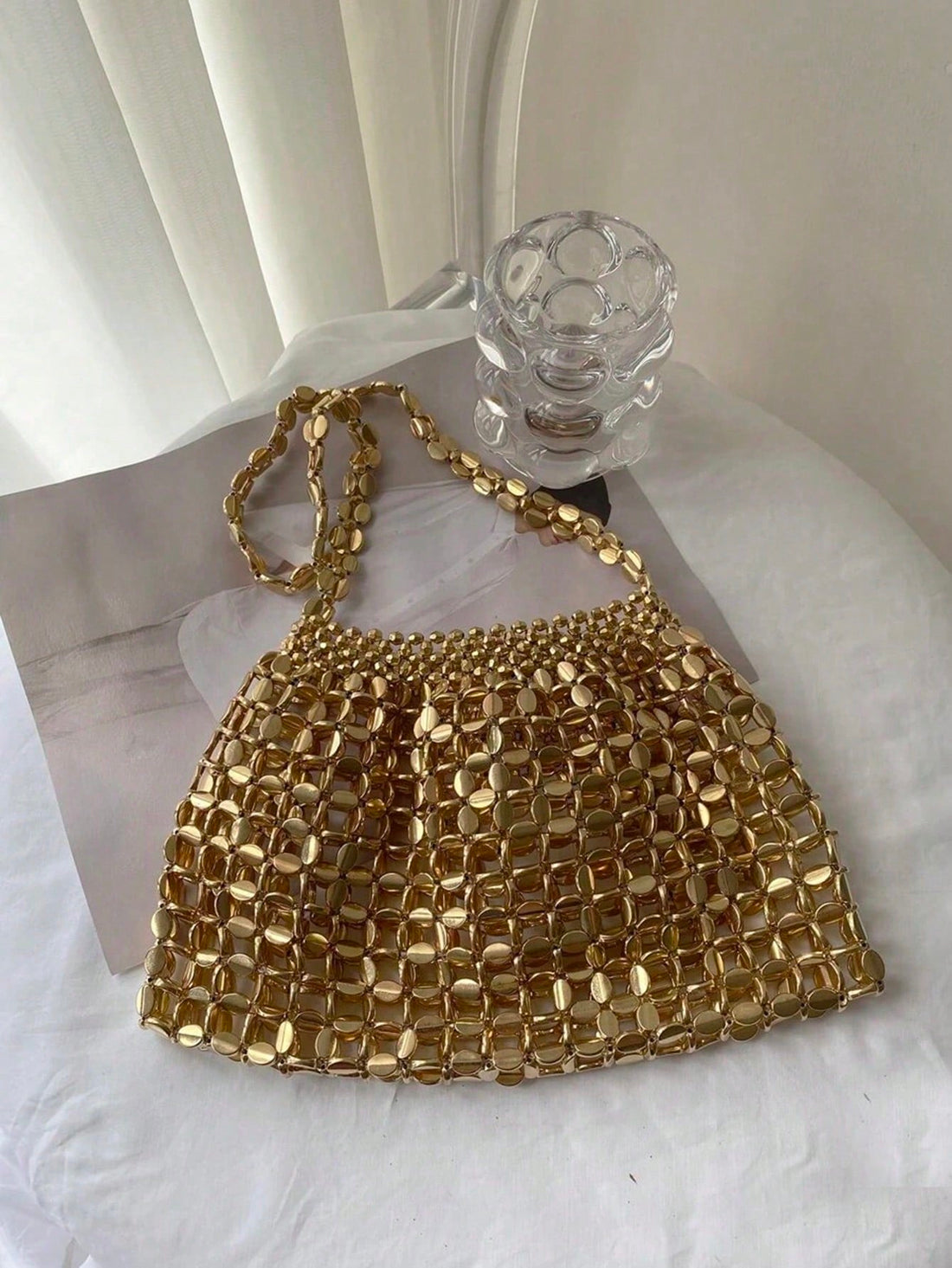 Add a splash of sparkle to your night with this Glamorous Gold Sequin Evening Bag. Perfectly sized to hold your essentials, it dazzles at parties, weddings, and prom, making you the center of attention. Its shimmering gold sequins catch the light beautifully, adding a playful touch of luxury to any outfit. Get ready to shine and make every moment unforgettable!