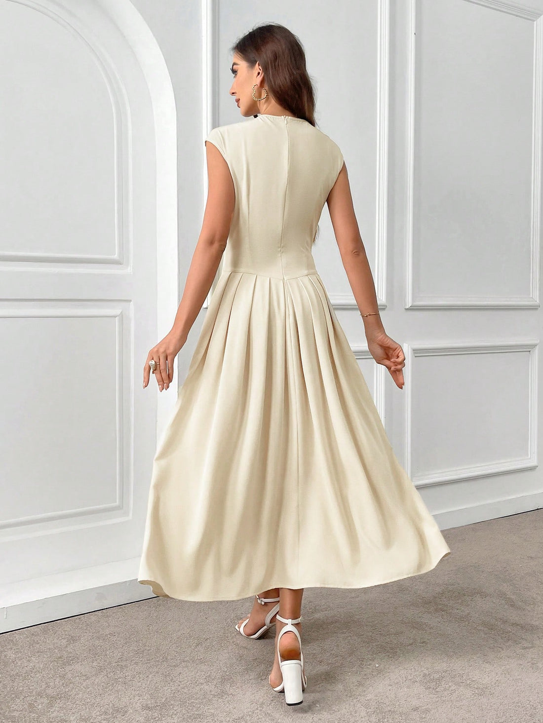Introducing our Elegant Solid Color Pleated Summer Dress - perfect for evening wear! Made with short sleeves and lightweight fabric for comfort, and pleated for stylish detailing. This dress will have you feeling and looking elegant for any occasion.