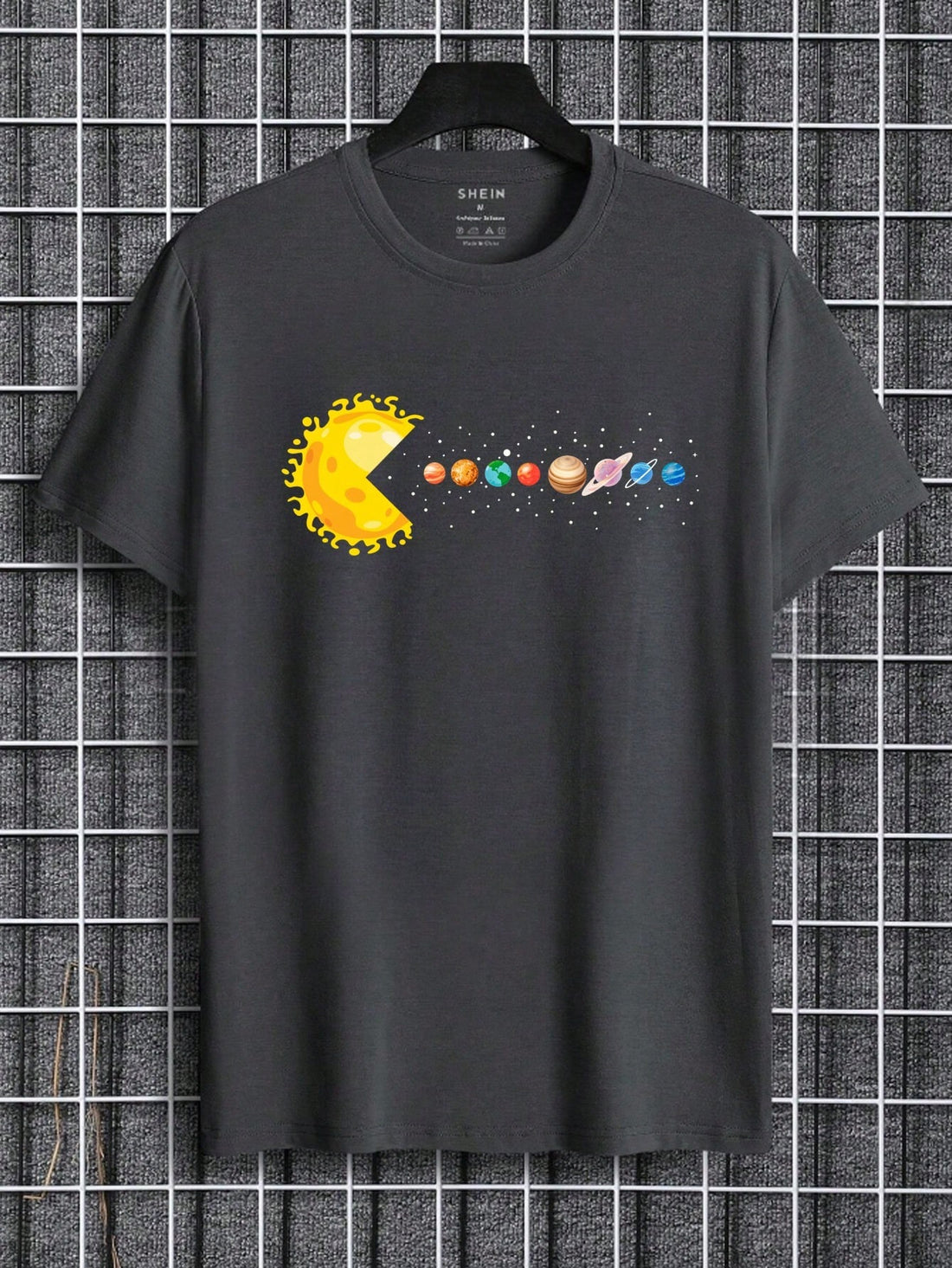 Upgrade your casual style with our Men's Printed Planets Loose Fit Tee. Its out-of-this-world planetary design is sure to turn heads. Crafted with comfort in mind, this tee features a loose fit for all-day wear. Perfect for the space enthusiast in your life.