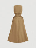 Back view of camel tan fit and flare midi dress with full skirt