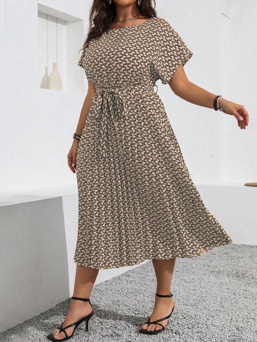 Front three-quarter view of khaki geometric plus size maxi dress with self-tie belt