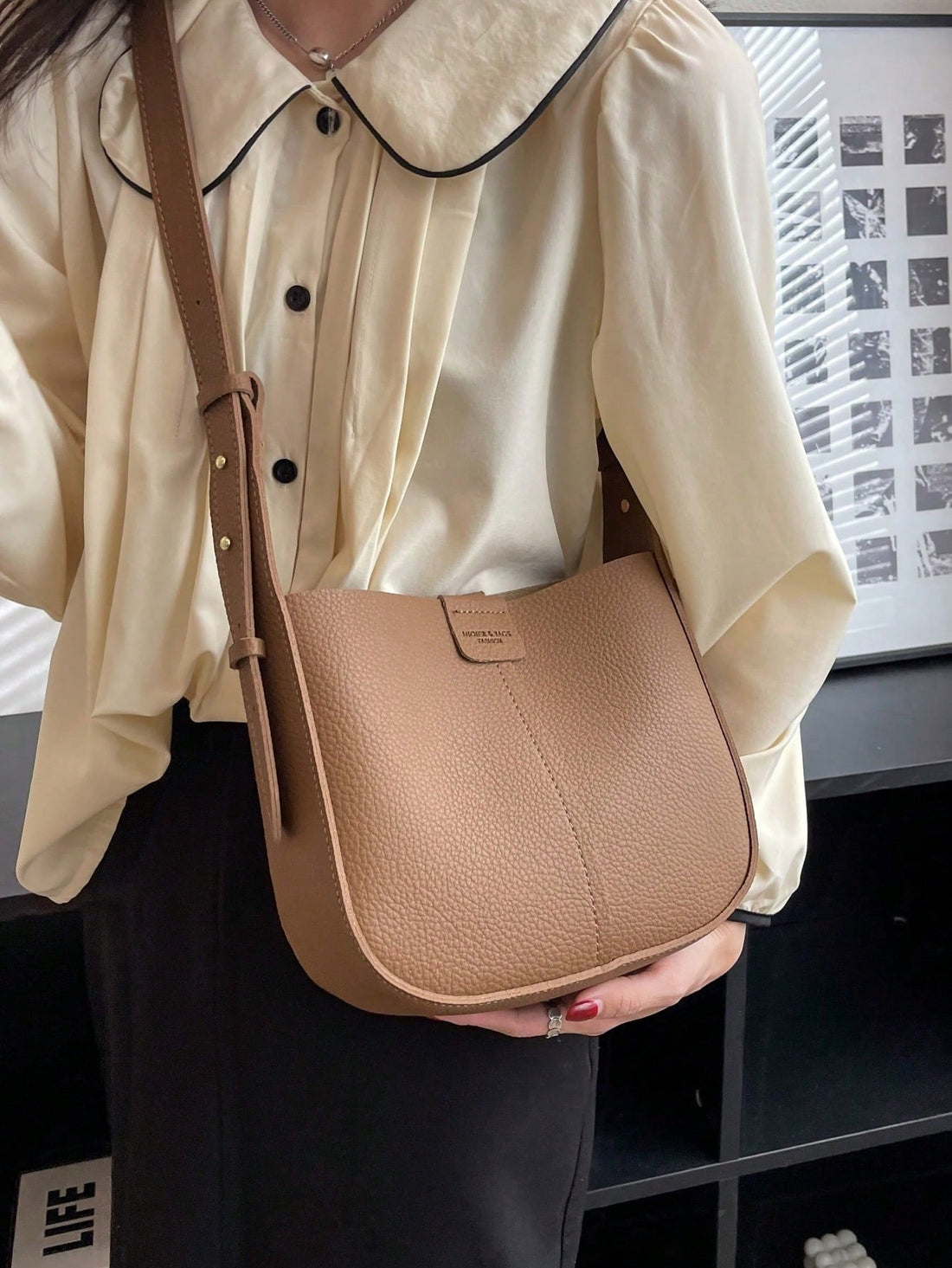 This Patchwork Perfection bag is versatile and stylish with its convertible crossbody design and inner pouch. Perfect for on-the-go fashion, it offers easy organization and hands-free convenience. Made with high-quality materials, it is durable and functional for everyday use. Experience patchwork perfection today.
