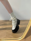 White Winter Wonderland: Chic Platform Boots for Fashionable Riders