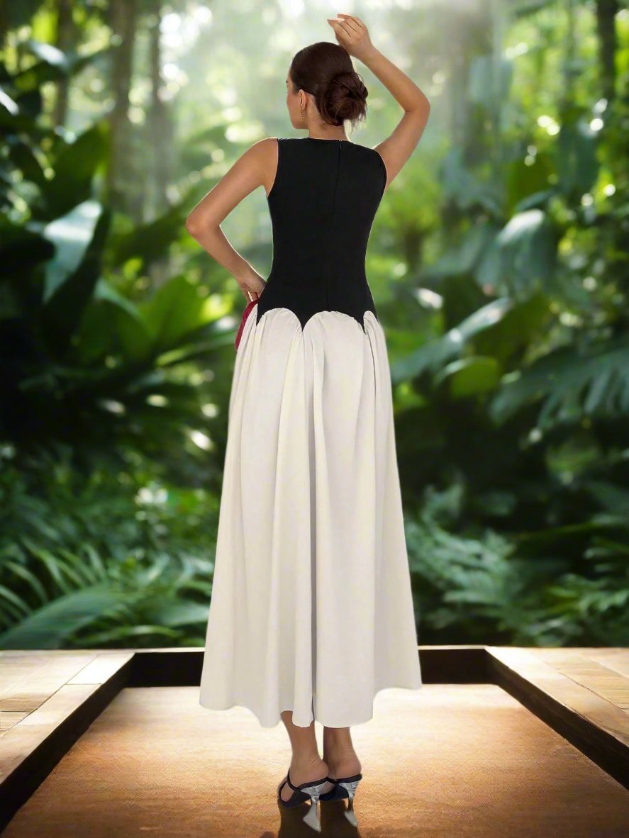 Step into summer with our Elegant Summer Chic: Color Block Sleeveless Dress. Composed of high-quality materials, this dress offers effortless style and comfort. The color block design adds a touch of sophistication while the sleeveless cut keeps you cool and chic. Perfect for any occasion, this dress is a must-have for your summer wardrobe.