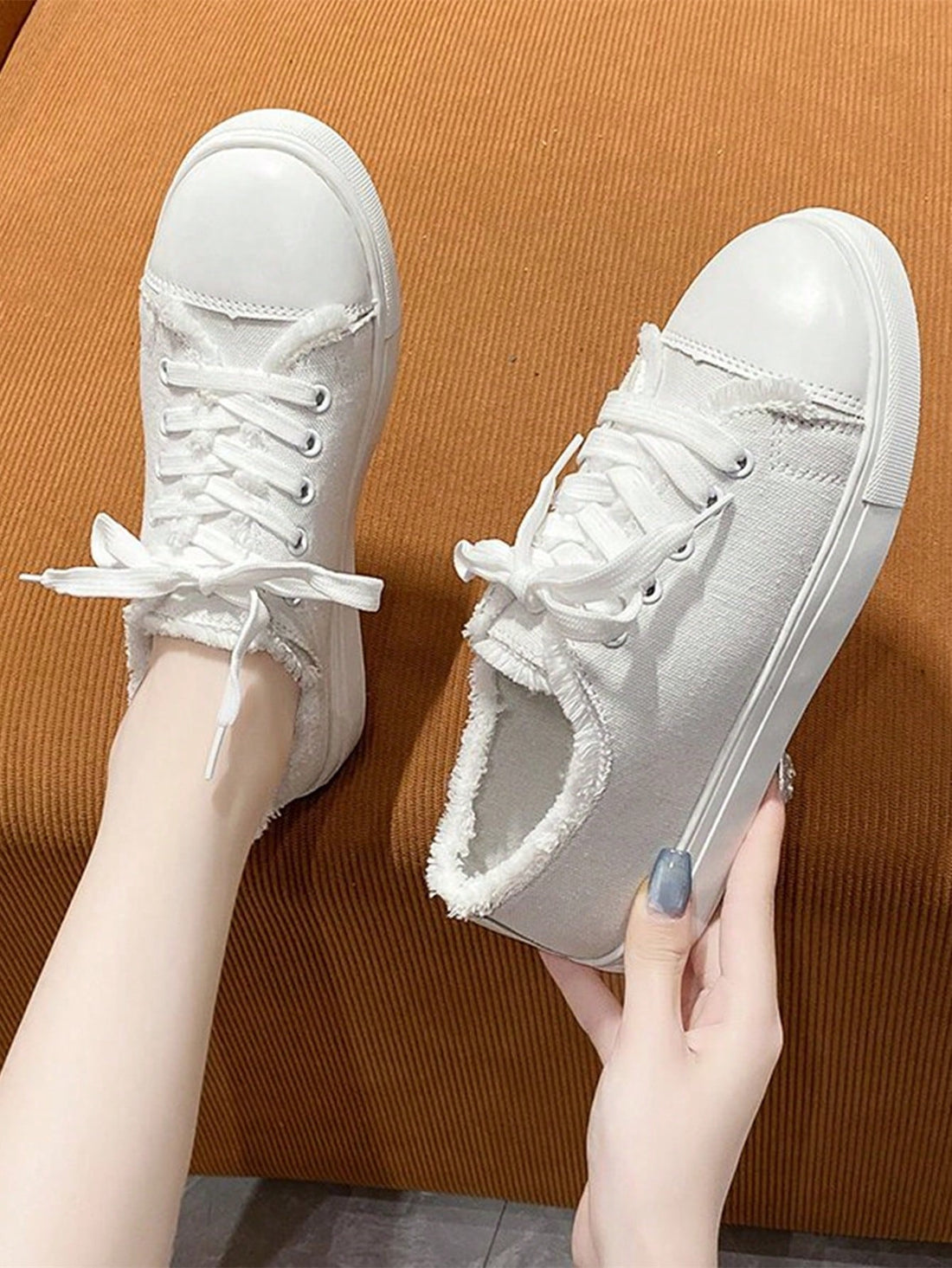 Experience comfort and style with our Campus Chic White Lace-Up Plus Size Sneakers. Perfect for casual sports, these sneakers offer a secure fit and modern look. Available in plus size, they provide superior comfort and support for any activity. Upgrade your sports wardrobe with Campus Chic.