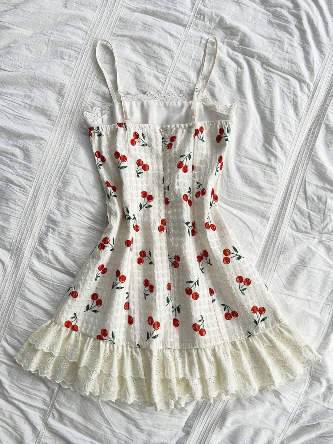 Discover the beauty of spring with our Cherry Blossom Delight dress. Made with delicate lace and ruffled accents, this vacation dress is perfect for a day out exploring. Embrace your femininity and feel effortlessly elegant in our Dreamara creation.