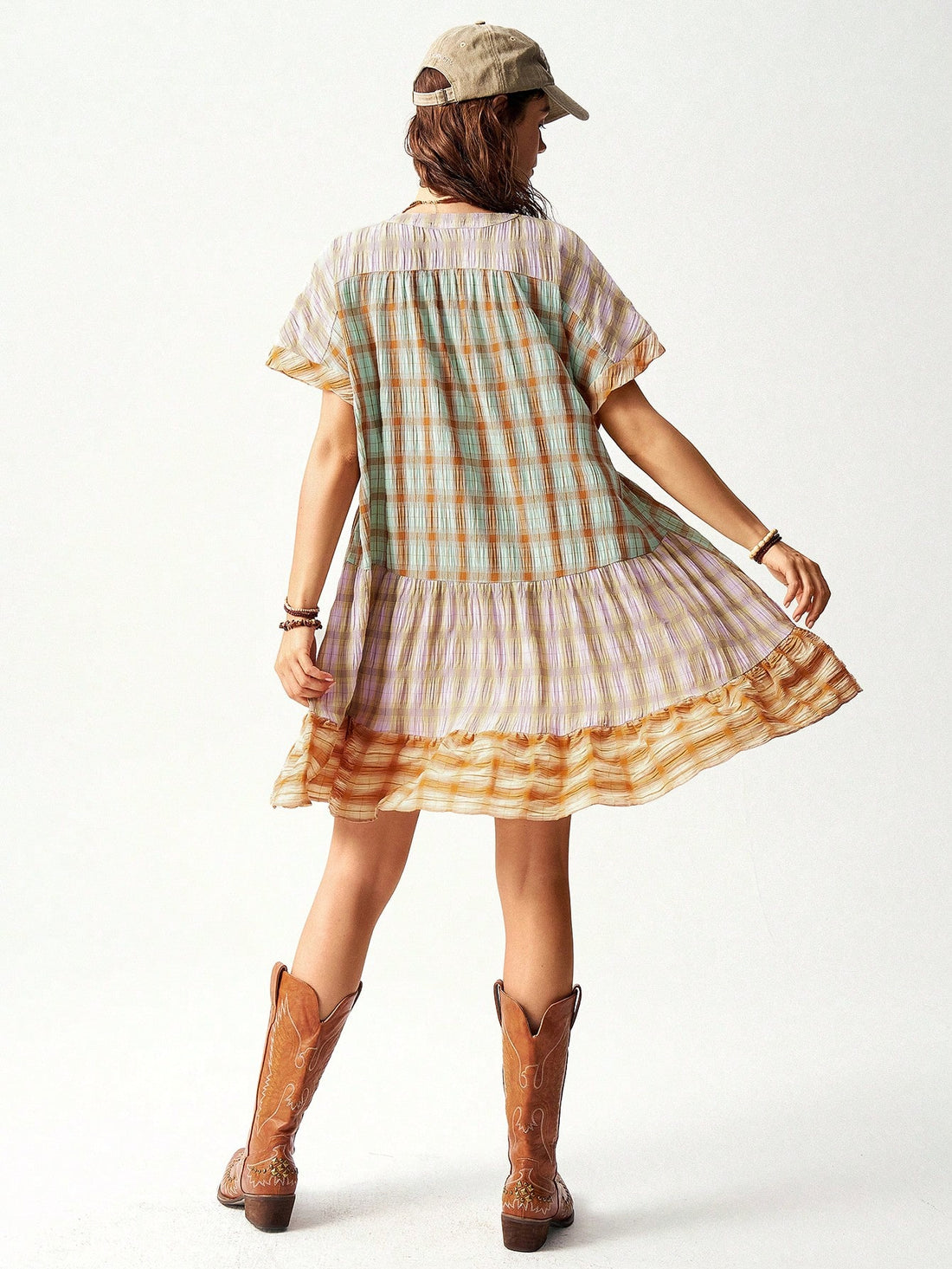 Experience effortless style with Bohemian Vibes: Multi-Colored Plaid Patchwork Vacation Dress. The perfect choice for a chic vacation look, this dress features a stunning combination of vibrant colors and plaid patterns. The patchwork design adds a unique touch to your outfit, while the lightweight fabric keeps you comfortable and cool. Elevate your wardrobe with this must-have dress.