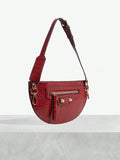 Vintage retro shoulder bag close-up with rivets