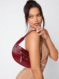 Detailed view of black rivet hobo bag