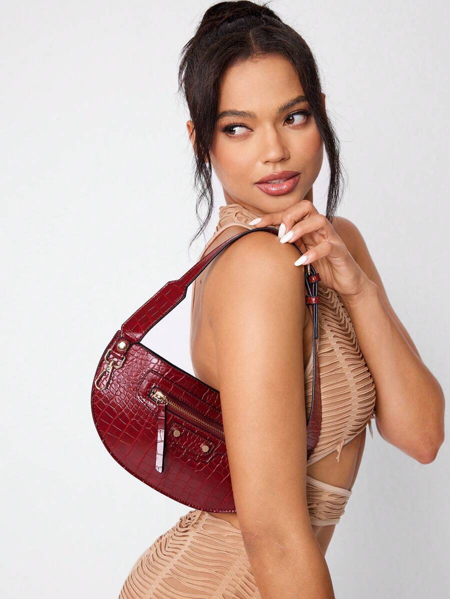 Detailed view of black rivet hobo bag