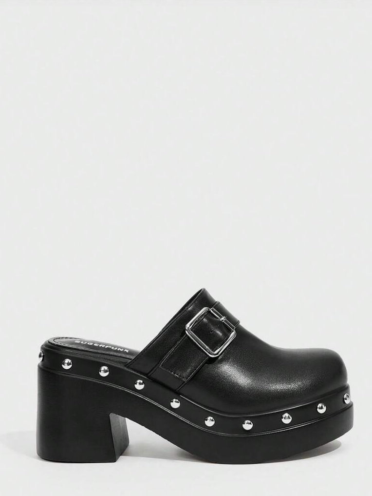 Exude Nocturnal Sophistication in Our Trendy Black Mules with Thick Sole!

Experience the breathtaking fusion of subculture heritage and sharp, modern architectural tailoring. This stunning buckle-accented shoe is meticulously designed for the woman who values a high-fashion, "quiet luxury" approach to edgy seasonal dressing—the ultimate centerpiece for prestigious city retreats, exclusive midnight soirées, and high-authority Y2K-inspired outings.

Iconic Punk & Buckle Artistry: Featuring a masterfully cura