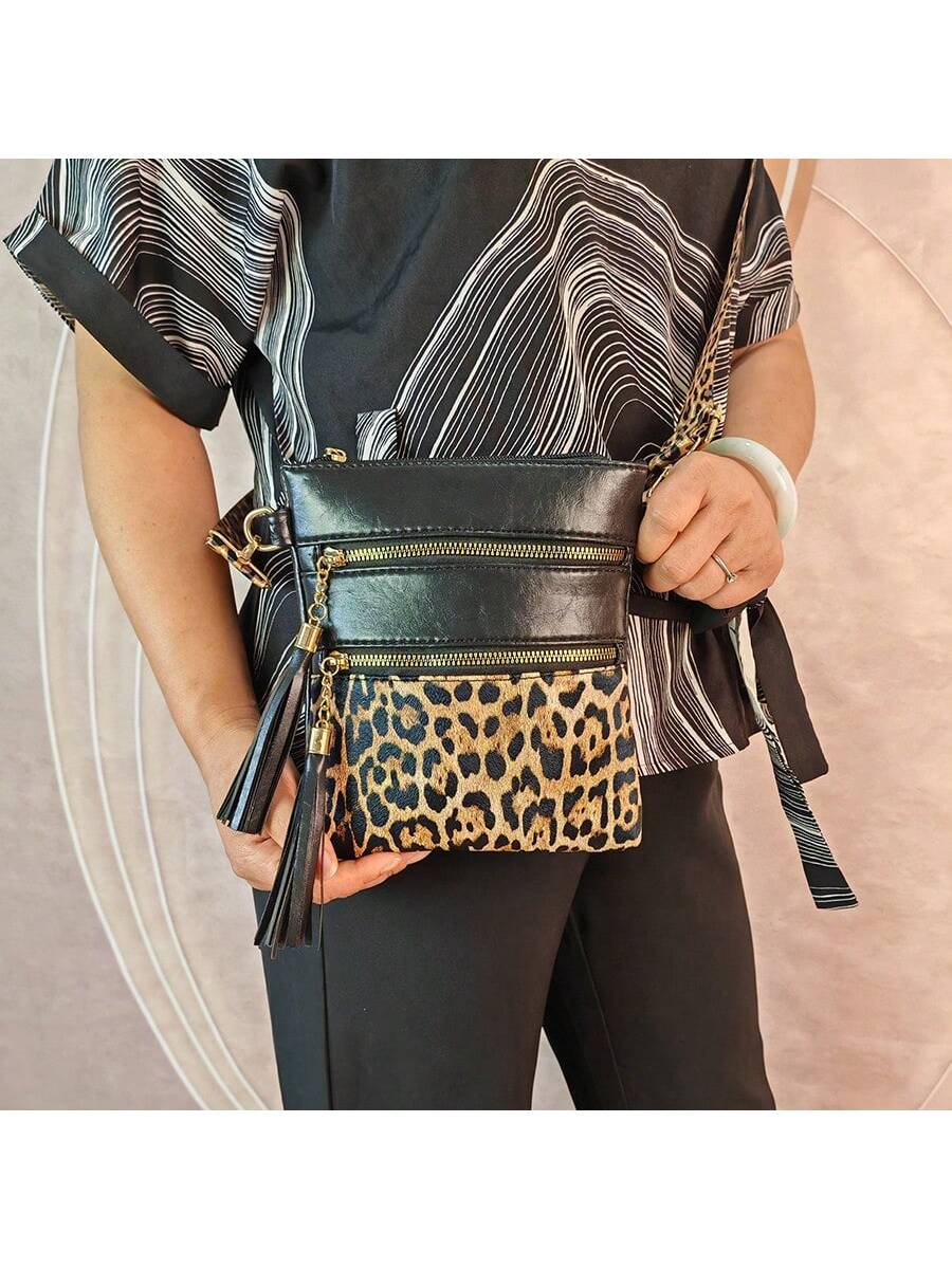 Experience fierce fashion with our Wildly Chic Leopard Print Tassel Crossbody Bag - your go-to statement piece for any outing! Featuring a stylish leopard print and playful tassel, this bag adds the perfect touch of wild to any outfit. Stay on-trend with this must-have accessory.