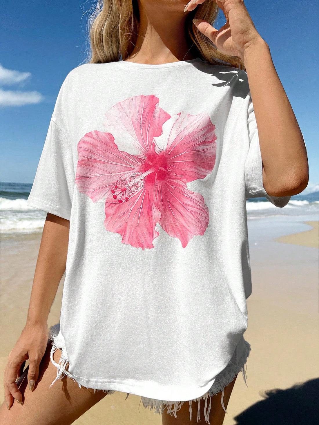 Complete your summer wardrobe with our Chic Minimalist Pink Hibiscus Floral Graphic T-Shirt. Effortlessly stylish, this shirt features a beautiful pink hibiscus floral design that adds a touch of elegance to any outfit. Perfect for those looking for a simple yet fashionable look this season.