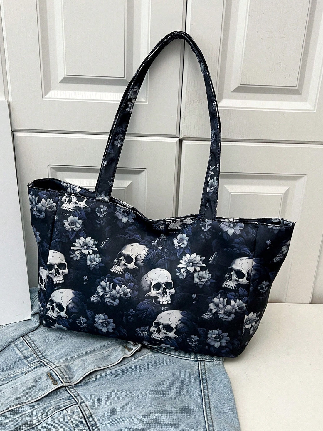 Designed for ultimate versatility, the Skull Shoulder Tote is perfect for school, work, and shopping. The vintage canvas material adds a touch of style, while the spacious interior and sturdy shoulder straps make it ideal for carrying all your essentials. Stay fashionable and functional with this must-have tote.