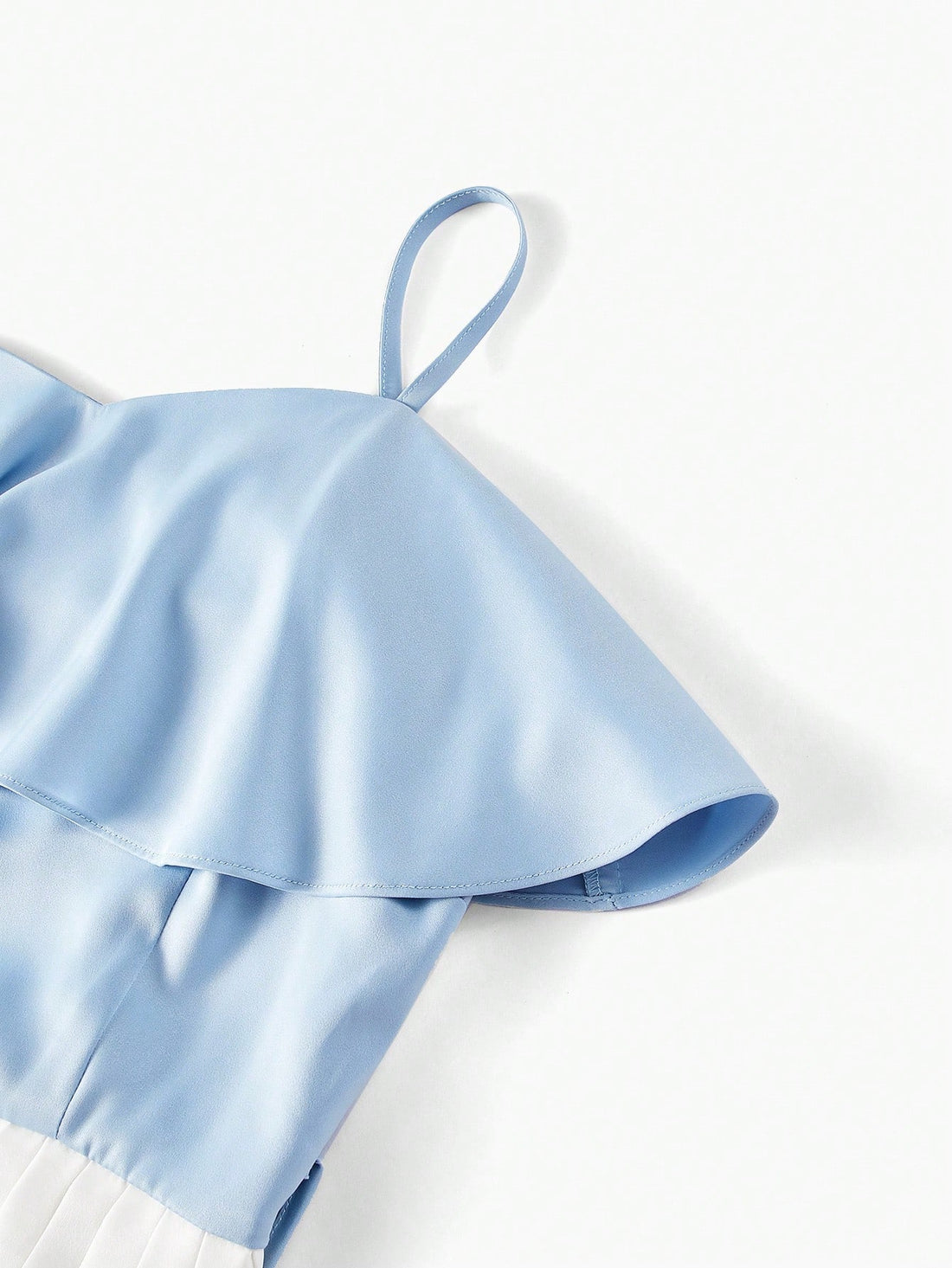 Indulge in chic and elegant style with our Two-Tone Ruffle Trim Slip Dress. The buckle belt adds a touch of sophistication while the ruffle trim adds feminine flare. Perfect for any occasion, this dress will make you stand out in any crowd.