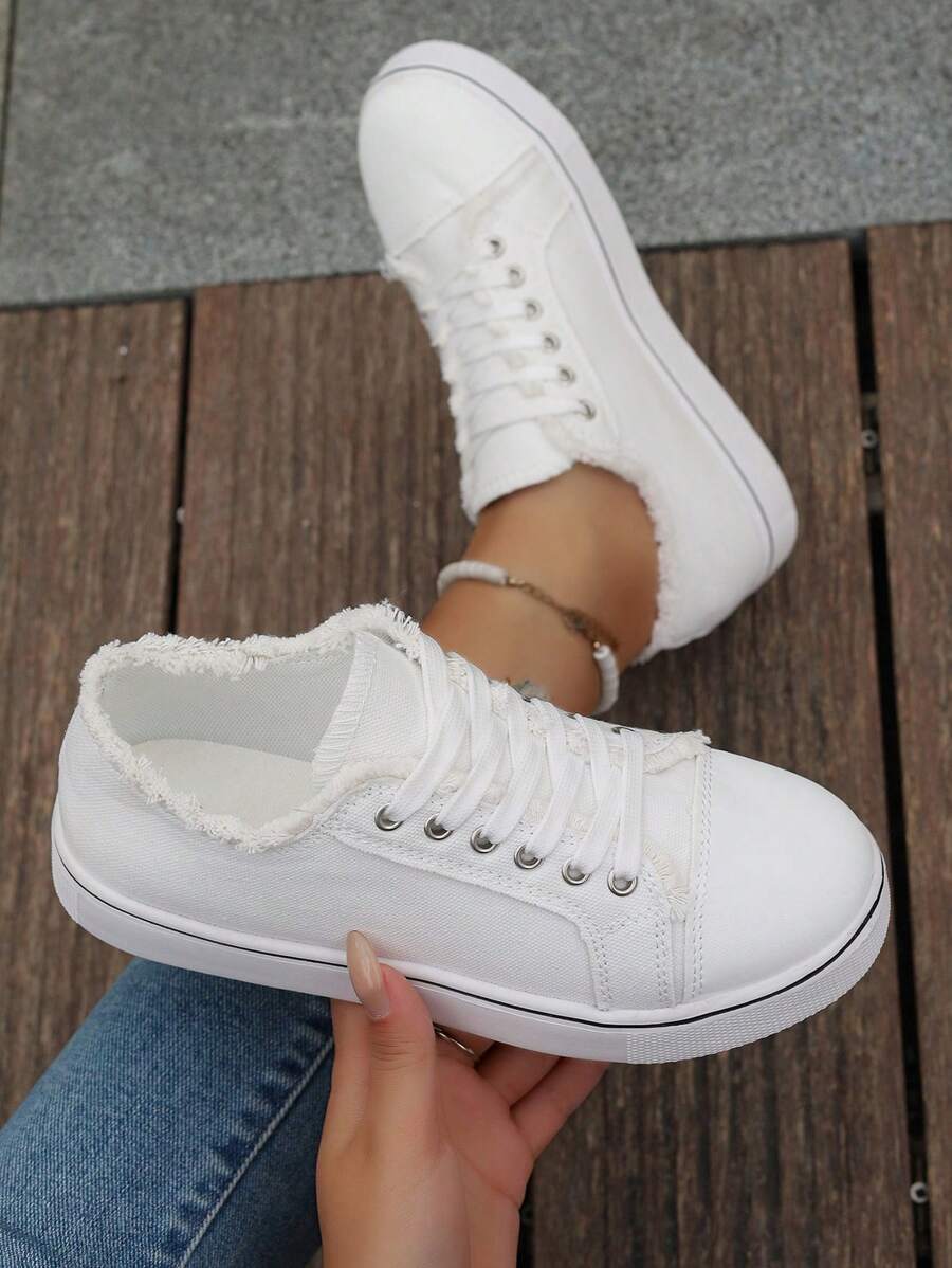 Step out in style and comfort with these playful women's round toe canvas sneakers. Featuring a cozy fuzzy trim, they add a fun twist to your everyday look. Perfect for campus strolls or casual outings, these sneakers keep your feet comfy while turning heads wherever you go.