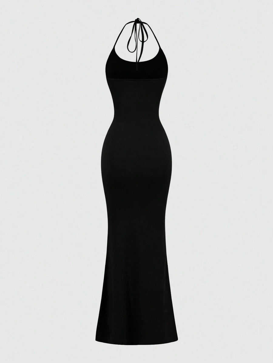 Turn heads with this Elegant Backless Halter Fishtail Dress, designed to make every special occasion unforgettable. Its sleek solid colors and daring backless cut add a flirty twist, while the fishtail silhouette gracefully highlights your curves. Perfect for dancing the night away or stealing the spotlight, this dress combines sophistication with a playful edge.
