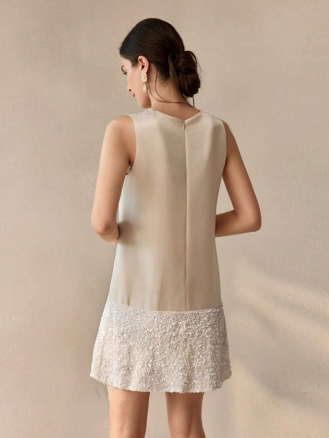 This stylish Sparkling Bow Front Mini Dress will make you shine at your next event. Crafted with a bow front detail, it features dazzling sparkles that will catch everyone's attention. Designed to make a statement, this dress is perfect for any occasion, giving you a confident and glamorous look.