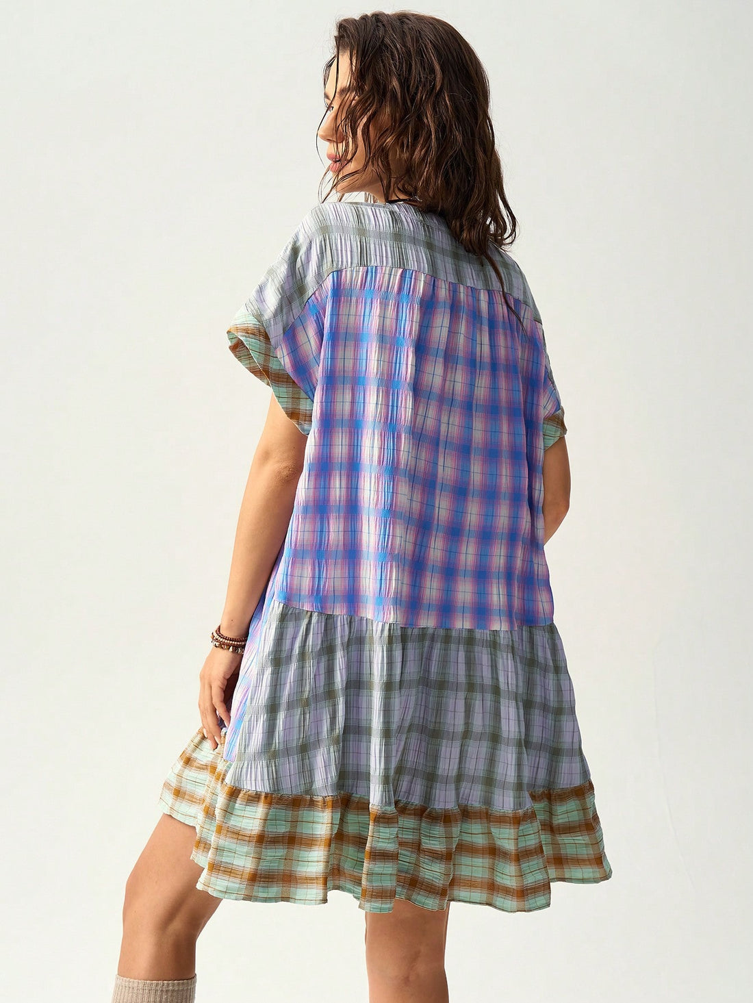 Add a pop of color to your summer with the Bohemian Bliss dress. Vibrant multicolor checkered patchwork creates a playful yet chic look. Perfect for any occasion - dress it up for a night out or keep it casual for a day at the beach. Get your boho vibe on!