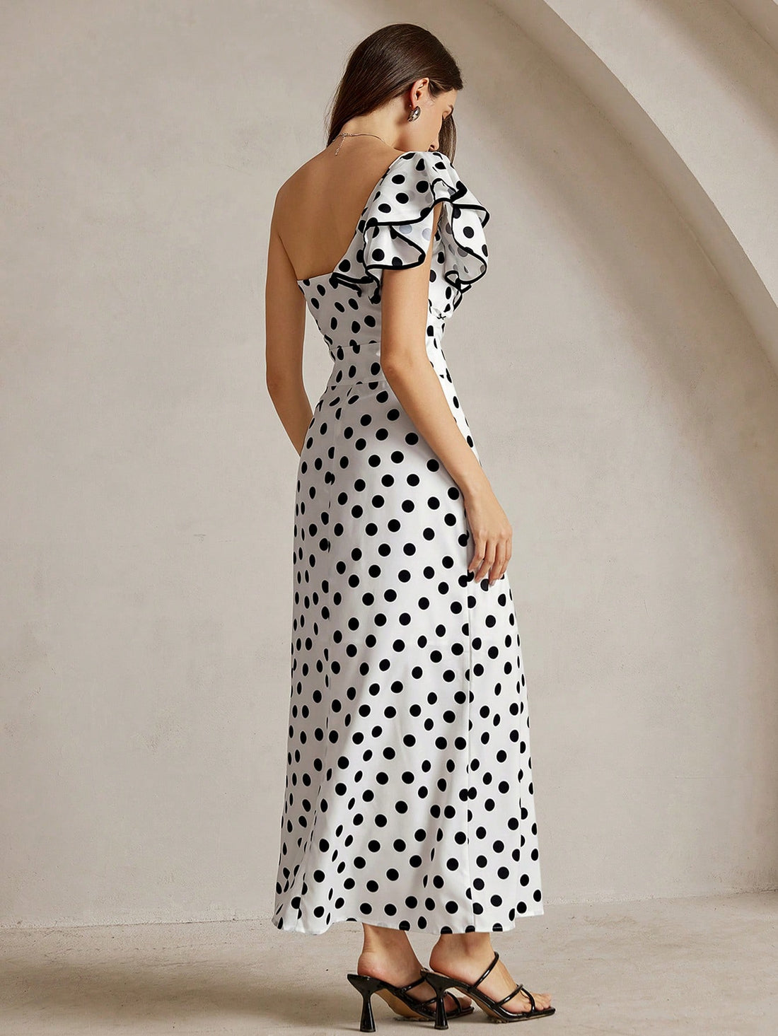 Make a statement with this playful polka dot one-shoulder mini dress that effortlessly blends fun and sophistication. The asymmetrical neckline adds a modern twist, while the classic dot pattern keeps things timeless and versatile. Perfect for casual outings, weekend brunches, or dressing up with the right accessories, this piece transitions seamlessly from day to night. Lightweight and flattering, it's the go-to dress for anyone who loves a touch of whimsy with their everyday style.