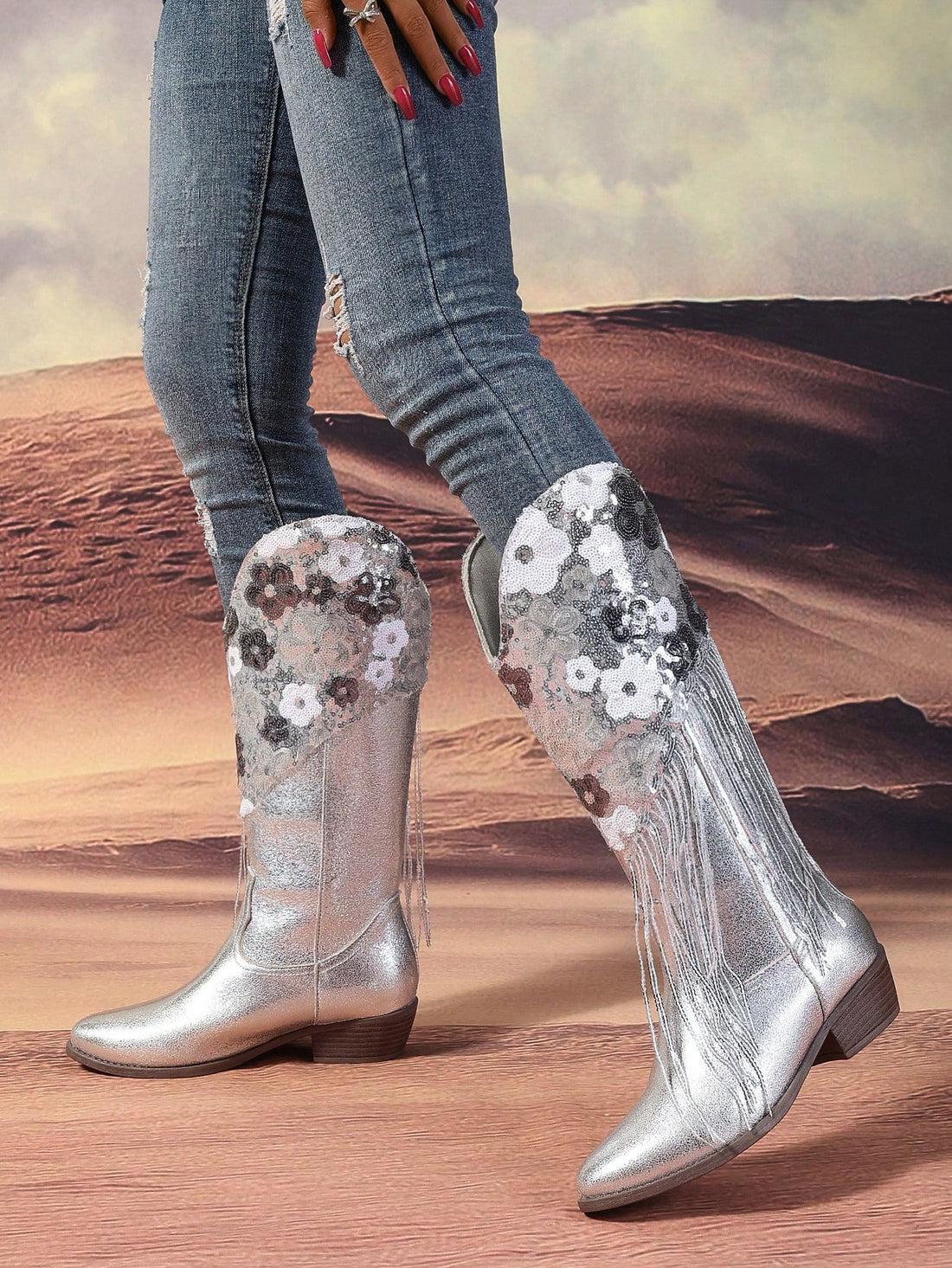 Elevate your fall/winter fashion with our sleek and chic silver floral sequin tassel trim knight boots. Embrace the season in style and comfort while making a statement with the intricate floral design and added tassel details. Perfect for keeping you on trend and warm all season long.