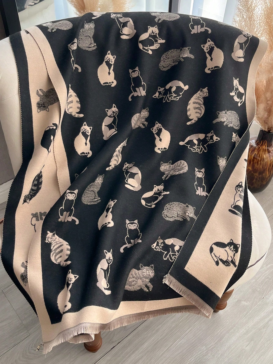 Elevate your style this autumn/winter with our Charming Cat Jacquard Scarf! Made with cozy faux cashmere, this accessory is perfect for staying warm while adding a touch of whimsy. The charming cat jacquard design is sure to turn heads and keep you stylish all season long.