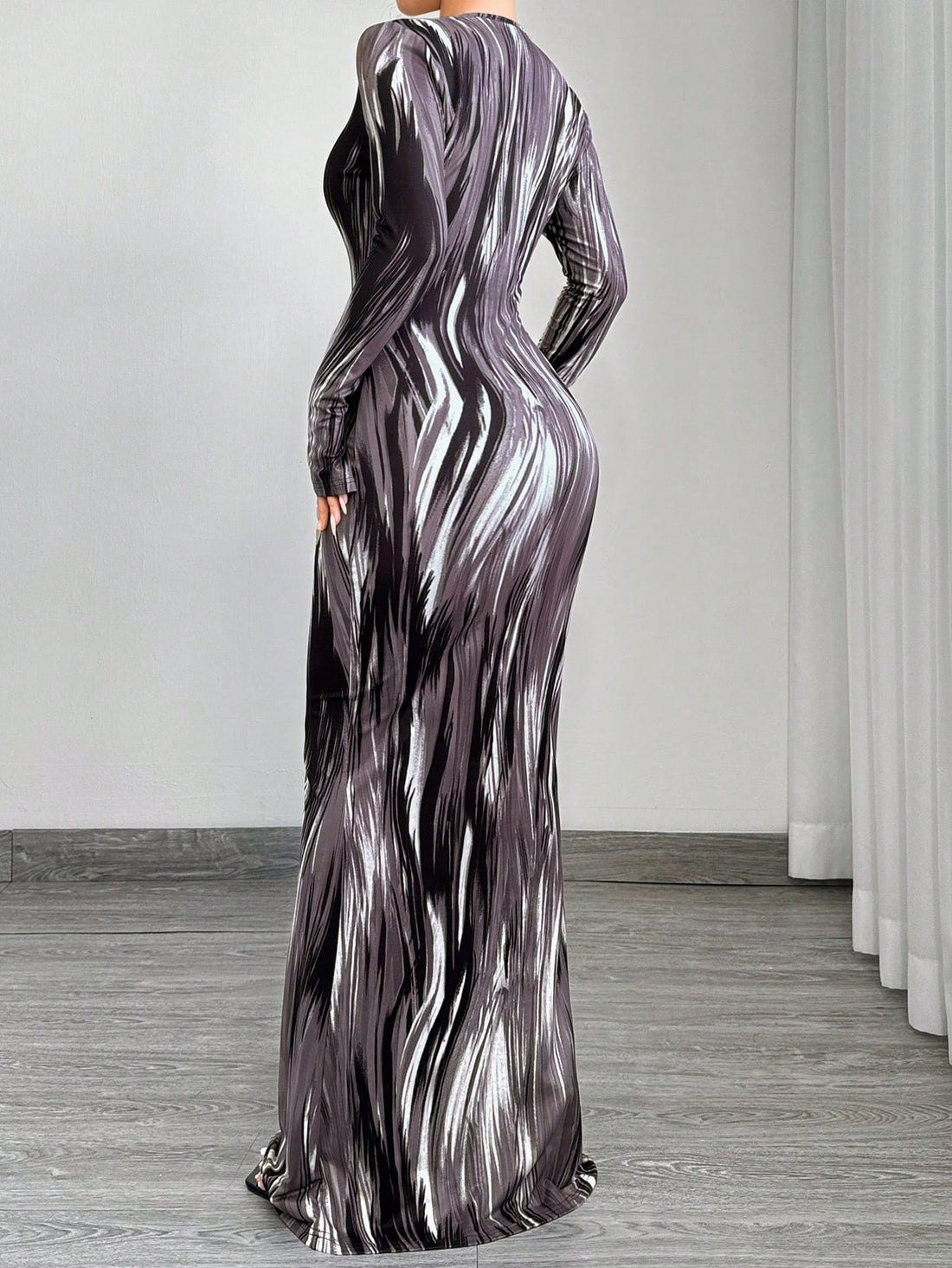Effortlessly elevate your style with our Gradient Glam Maxi Dress. Featuring a slimming fit, v-neckline, and long sleeves for added elegance. The gradient design adds a touch of sophistication to this must-have dress. Experience effortless elegance with every wear.