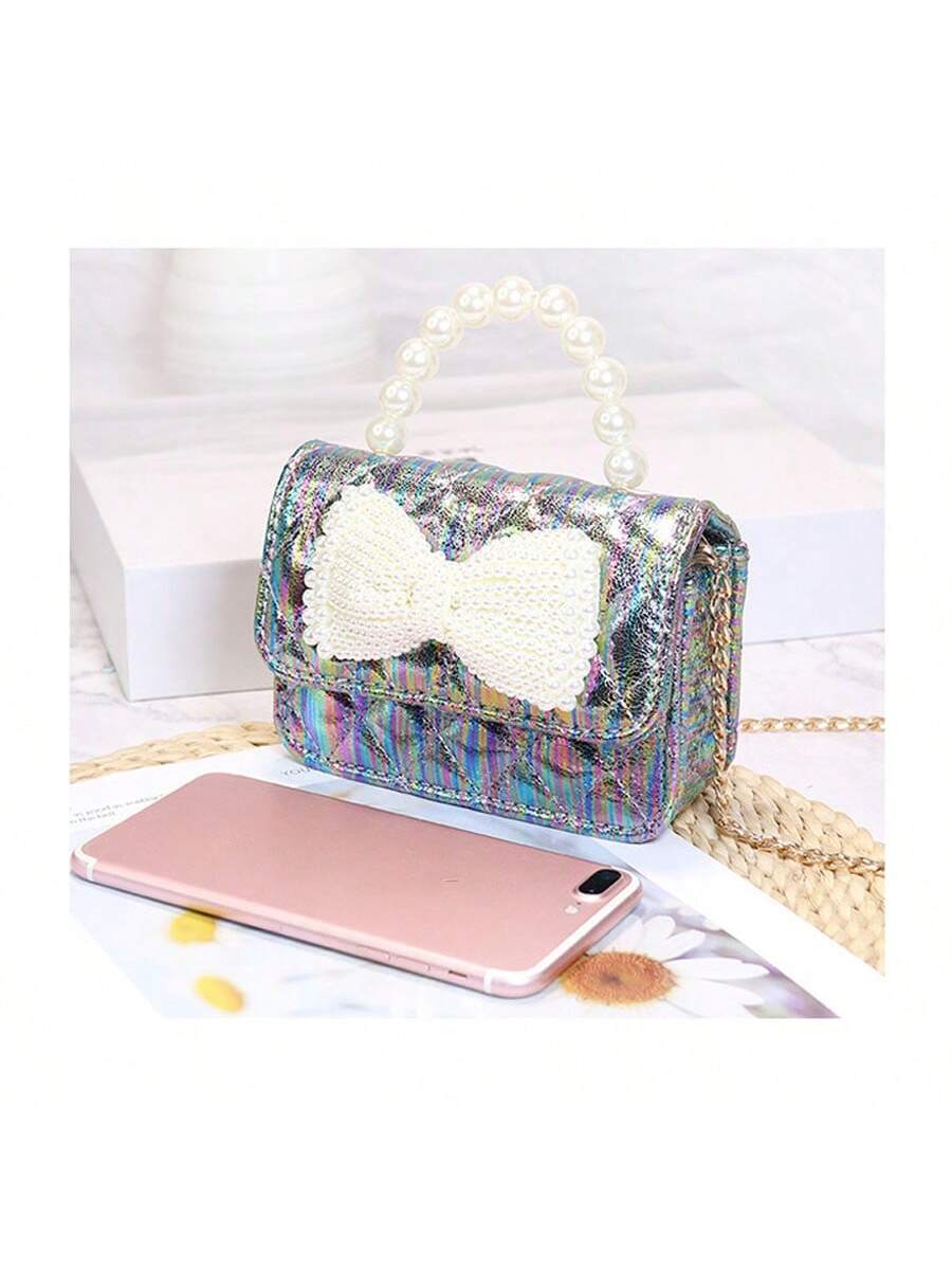 Elevate your style with Pearl Bow Bliss: Korean Style Crossbody Bag for Women. This elegant bag features a chic pearl bow design, adding a touch of sophistication to any outfit. The crossbody style offers convenience and functionality, making it the perfect accessory for any fashion-forward woman. Upgrade your look with this Korean-inspired bag.