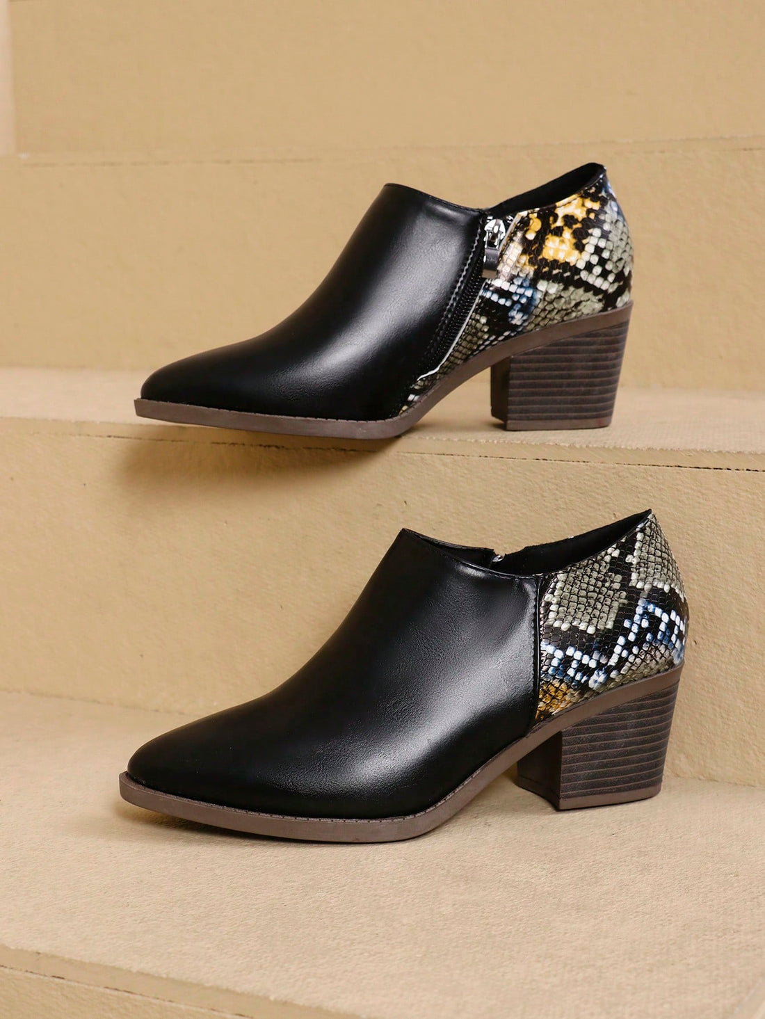 Experience style and comfort with our Plus Size Chunky Heel Color Block Ankle Boots for Women. These boots feature a stylish design and a chunky heel for added comfort. Available in plus sizes, they are perfect for any occasion. Upgrade your wardrobe with these trendy and comfortable boots.