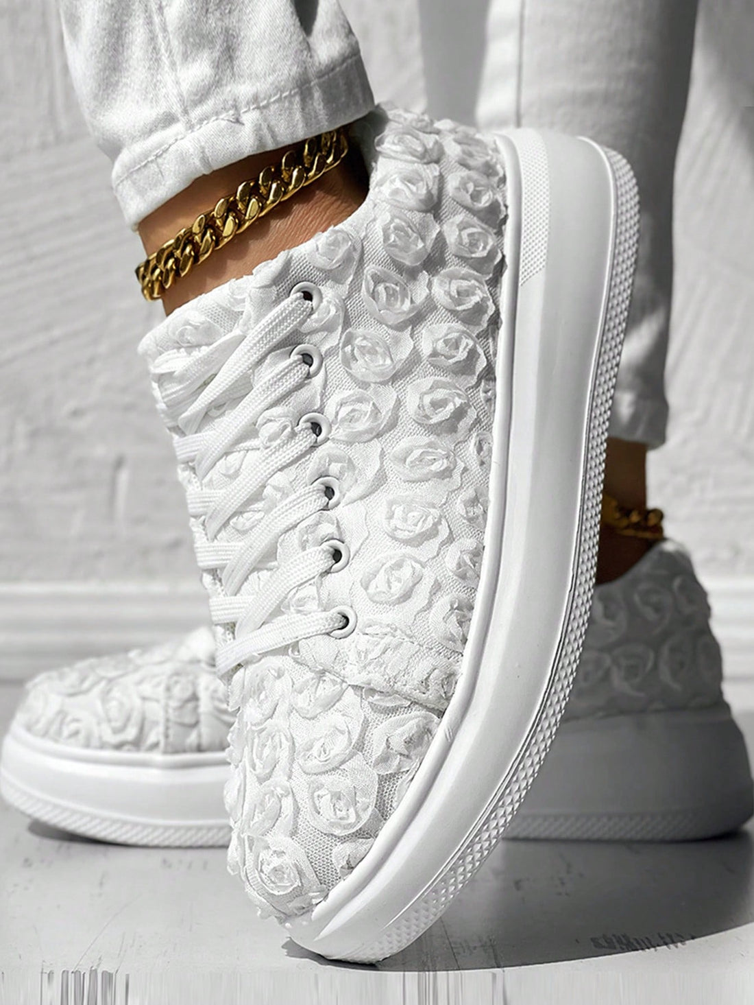 Elevate your wedding day look with our Floral Fantasy bridal platform running shoes. With a comfortable platform and stylish floral design, these shoes are perfect for any bride looking to make a statement while staying comfortable. Boost your confidence and style on your special day.