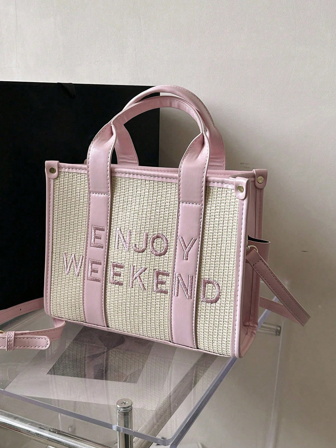 Elevate your style game with our versatile and chic minimalist letter woven tote bag. Crafted with expert craftsmanship and woven using quality materials, this bag is perfect for any occasion. With its stylish design and spacious interior, it's the perfect accessory for any fashion-forward individual.