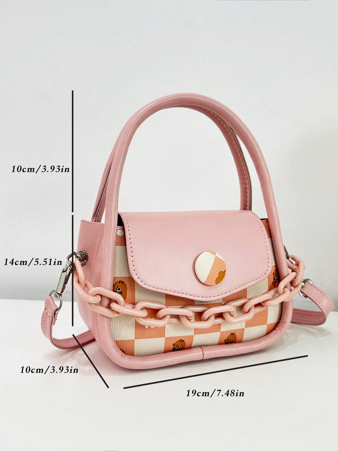 Introducing the Chic Plaid Chain Crossbody, the perfect accessory for your stylish summer look. With its trendy plaid design and convenient chain strap, this bag will elevate your outfit while keeping your essentials close at hand. 