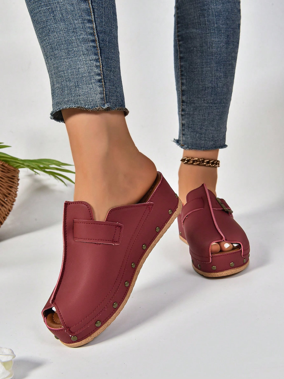 Stun in style with our Studded Elegance sandals. These Women's Red Wedge Heel Sandals are sure to turn heads. The studded design adds chic elegance to any outfit. With a comfortable wedge heel and beige cloth material, you'll feel confident and stylish all day long.