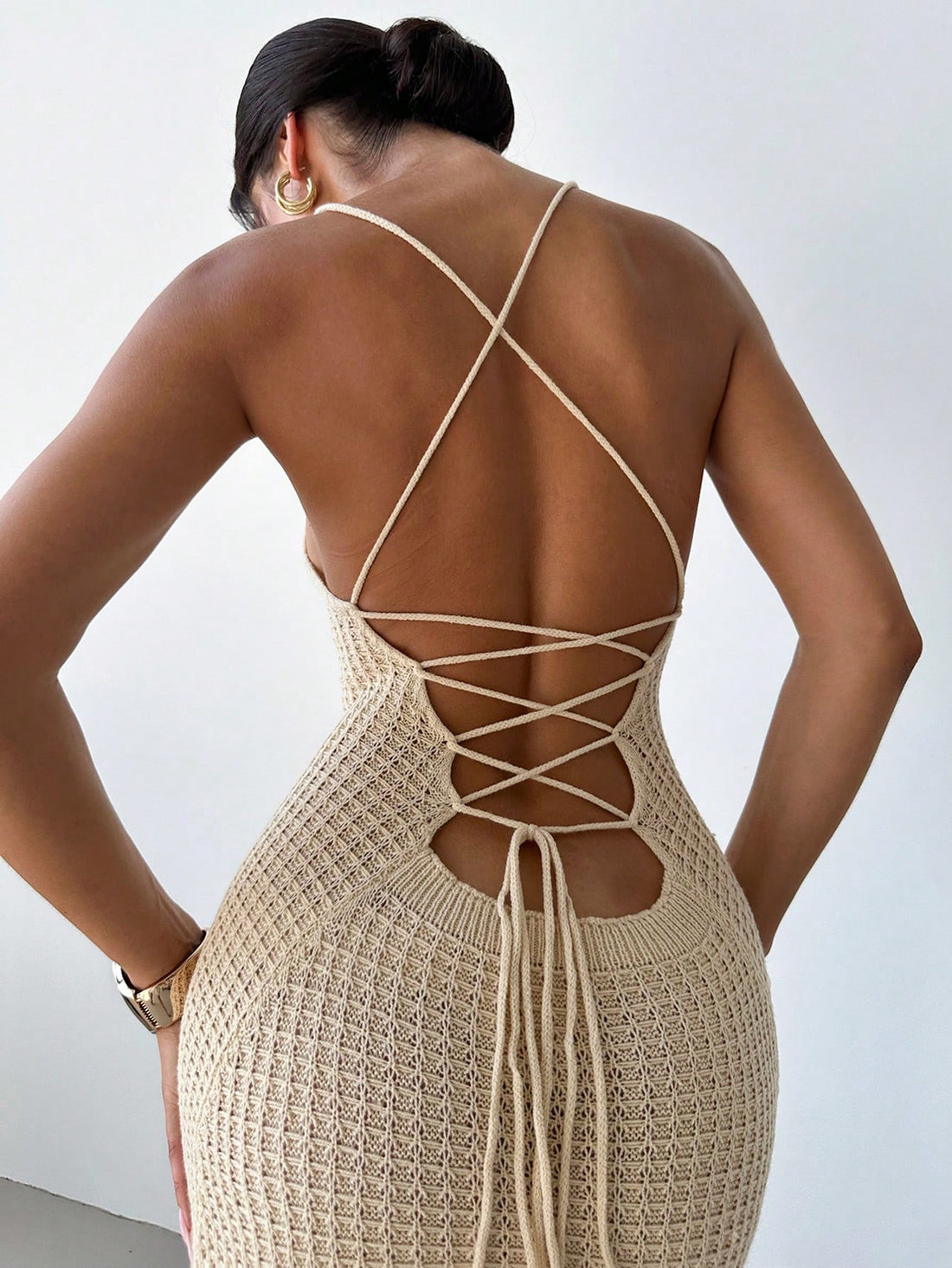 Get ready to turn heads in our Chic Criss-Cross Backless Bodycon Midi Dress! With a playful, criss-cross back design and a sexy side slit, this dress is perfect for any occasion. Let your quirkiness shine through with this unique and stylish dress.