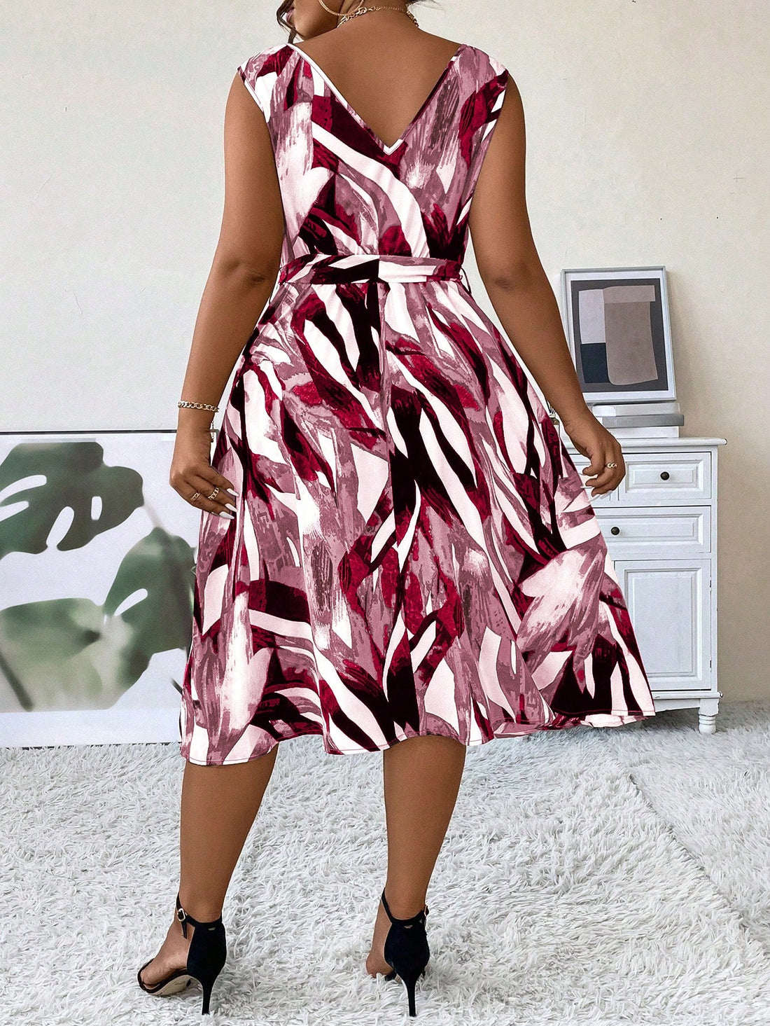 Effortless elegance at its finest. Our Plus Size Belted V-Neck Sleeveless Summer Dress exudes sophistication and comfort. With its flattering v-neck and slimming belt, this dress will enhance your curves and add a touch of elegance to your summer wardrobe. Made for the confident, stylish woman.