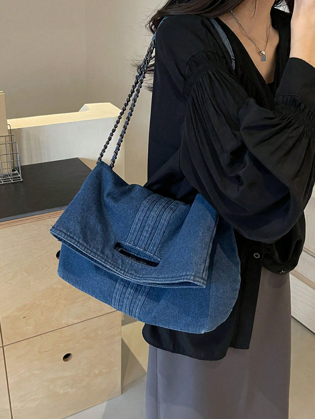 This Chic Canvas Shoulder Bag is not only stylish with its elegant solid color design, but also functional with its durable canvas material. The chain handle adds a touch of sophistication, making it the perfect accessory for any woman. Stay fashionable and organized with this must-have bag.