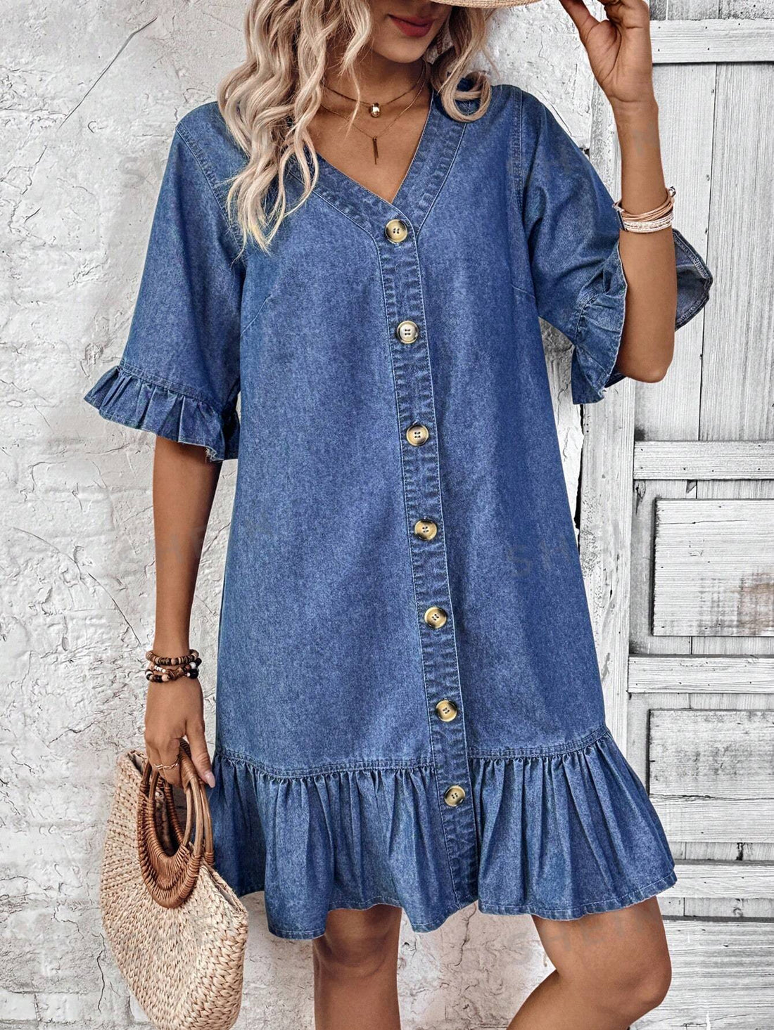 Experience the perfect blend of style and comfort with our Summer Chic V-Neck Denim Dress. Designed for the modern woman, this dress features a flattering V-neck, ruffle detail, and lightweight denim fabric. Elevate your summer wardrobe with this versatile and trendy piece.